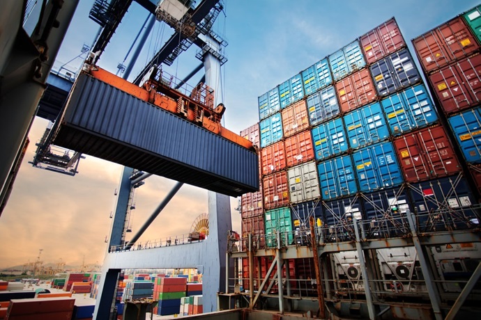 Shipping containers being loaded onto freight ship